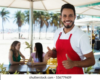 Laughing Waiter Of A Cocktail Bar At Beach