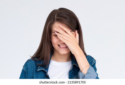 Laughing Woman Embarrassed With Her Silliness Covering With Hand. Facepalm Failure And Shame Concept.