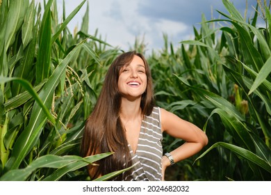 Laughing Woman Standing In The Corn Field