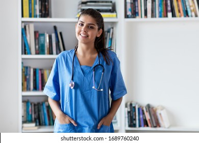 Laughing Young Adult Spanish Female Nurse Or Medical Student At Hospital