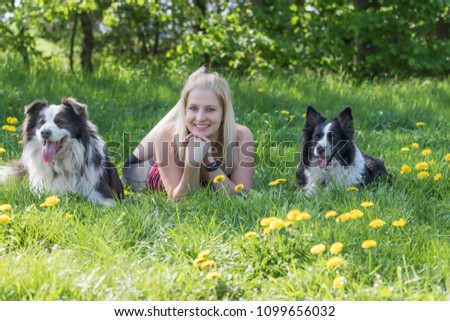 Similar – Image, Stock Photo Blond woman with her two dogs in the countryside