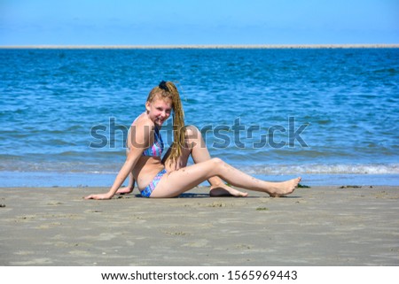 Similar – Young woman and Labrador at the Baltic Sea beach