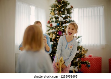 Laughing young girl on Christmas Day. - Shutterstock ID 1283951695