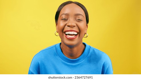Laughing young woman, Black beautiful, yellow background studio - Shutterstock ID 2364727691