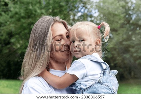 Similar – Granddaughter hugging her grandmother