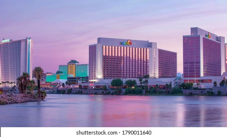 Laughlin, NV, USA 8/4/20 — Edgewater, Tropicana, and Aquarius hotels on Casino Drive. Captured from Bullhead City in Arizona on the other side of the Colorado River. Beautiful pink and purple sunset.