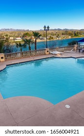 Laughlin, NV / USA – February 16, 2020: Located in the city of Laughlin, NV, Harrah’s Casino and Resort’s swimming pool offers a view of the Colorado River and of Bullhead City, AZ. 