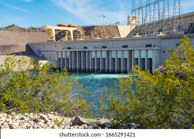 Laughlin, NV / USA – February 17, 2020: Water flows from The Davis Dam on the Colorado River north of Laughlin, Nevada and Bullhead City, Arizona.