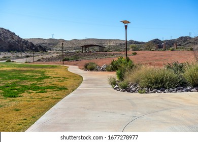 Laughlin, NV / USA – February 19, 2020: Paved walking trail at the Heritage Greenway Park and Trails located north of Laughlin, Nevada. 