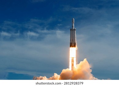 The launch of the space shuttle against the background of the sky and smoke. Elements of this image furnished by NASA. High quality photo