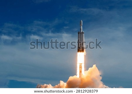 The launch of the space shuttle against the background of the sky and smoke. Elements of this image furnished by NASA. High quality photo