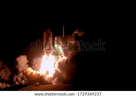 The launch of the space shuttle against the sky, fire and smoke. Elements of this image were furnished by NASA.