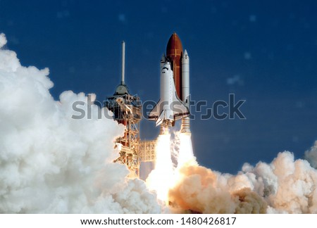 The launch of the space shuttle. With fire and smoke. Against the background of the starry sky. Elements of this image were furnished by NASA