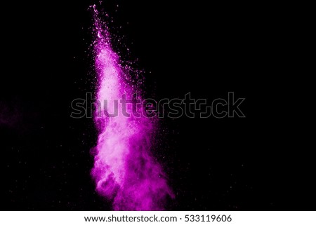 Launched colorful powder, Freeze motion of colored dust explosion isolated on black background.