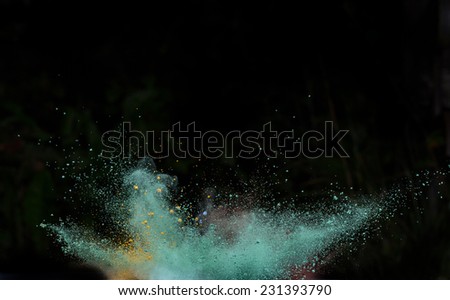 Launched colorful powder, isolated on black background