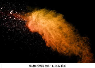 Launched Orange Powder On Black Background.