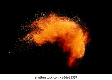 Launched Orange Powder On Black Background