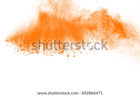 Launched orange powder on white background