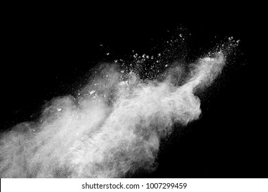 Launched White Particle Splash On Black Background.Freeze Motion Of White Particles On Black Background. White Granule Explosion. Abstract White Dust Overlay Texture.