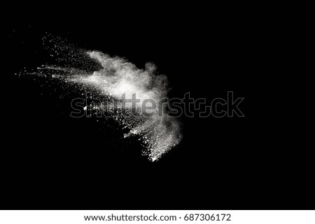 Launched white powder, isolated on black background
