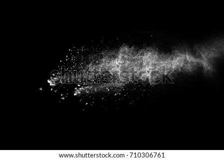 Launched white powder isolated on black background.