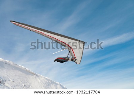 Launching hang glider pilot. Learning extreme sport. Extreme sport activity. Dream to fly and free flight concept
