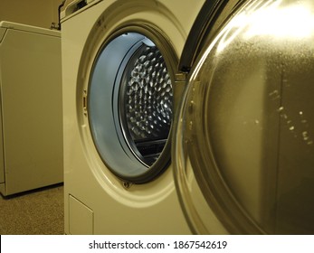 The Laundromat Door Is Open. Commercial Laundromat Is Ready For Clothes Loading.