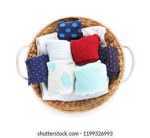 Laundry Basket With Folded Clothes On White Background, Top View