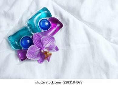  Laundry capsules on light background                - Shutterstock ID 2283184099