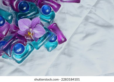  Laundry capsules on light background                - Shutterstock ID 2283184101