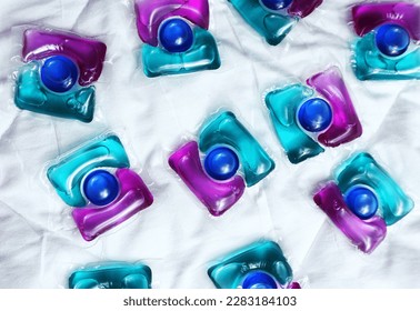 Laundry capsules on light background                - Shutterstock ID 2283184103