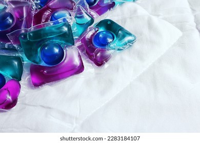 Laundry capsules on light background                - Shutterstock ID 2283184107