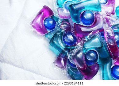  Laundry capsules on light background                - Shutterstock ID 2283184111