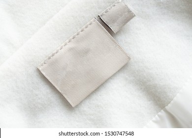 laundry care clothing label on fabric texture - Shutterstock ID 1530747548