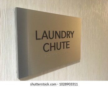 Laundry Chute Sign Mounted On Wall