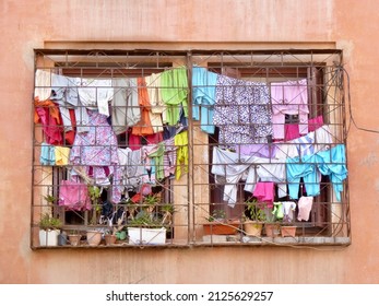 Laundry Day In Marrakech, Colorful Clothes Hanging Outside The Window. Morocco. High Quality Photo