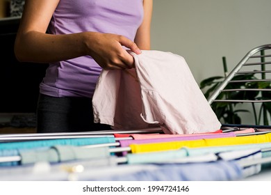 Laundry Day Rainbow Color Clothes Hanging On Washing Line To Dry Indoors Home