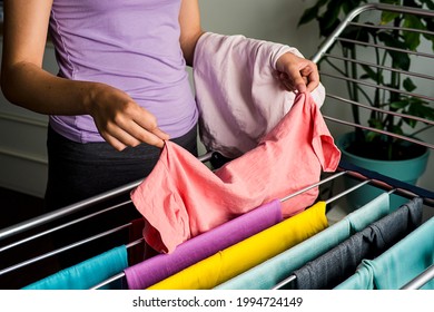 Laundry Day Rainbow Color Clothes Hanging On Washing Line To Dry Indoors Home