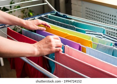 Laundry Day Rainbow Color Clothes Hanging On Washing Line To Dry Indoors Home