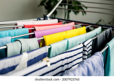 Laundry Day Rainbow Color Clothes Hanging On Washing Line To Dry Indoors Home