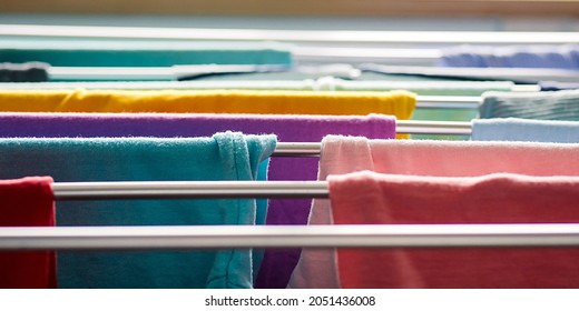 Laundry Day Rainbow Color Clothes Hanging On Washing Line To Dry Indoors Home