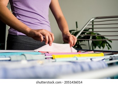 Laundry Day Rainbow Color Clothes Hanging On Washing Line To Dry Indoors Home