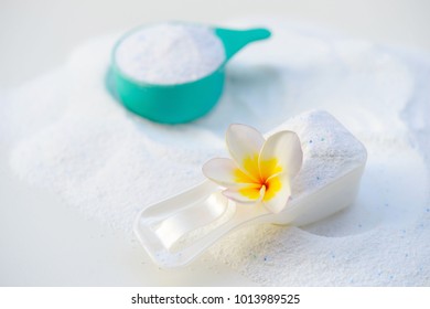 Laundry Detergent Powder For Washing Machine And Plastic Scoop For Dosage.