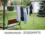 Laundry drying on a string, between blocks of flats, Gniezno, Poland.