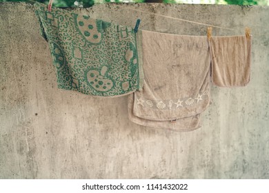 Laundry Hanging On A Clothes Line On An Old City Building. Hanging Laundry And Walls. Washing Hanging On Clothes Lines Between Buildings.