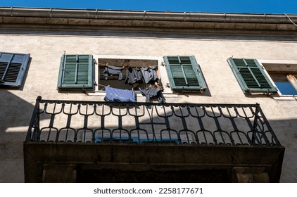 Laundry hanging in a window of an ancient building in Old Town Kotor, Montenegro - Shutterstock ID 2258177671