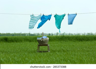 Laundry Line With Clothes In Field