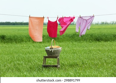 Laundry Line With Clothes In Field