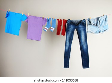 Laundry Line With Clothes On Wall Background