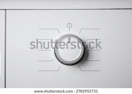 Laundry machine switch on off button. 